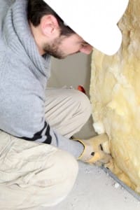 Wall insulation being installed by builder